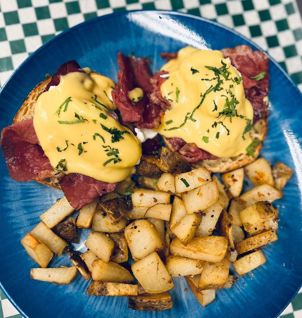 A classic brunch dish with a bold island twist — rich, savoury, spicy, and creamy.